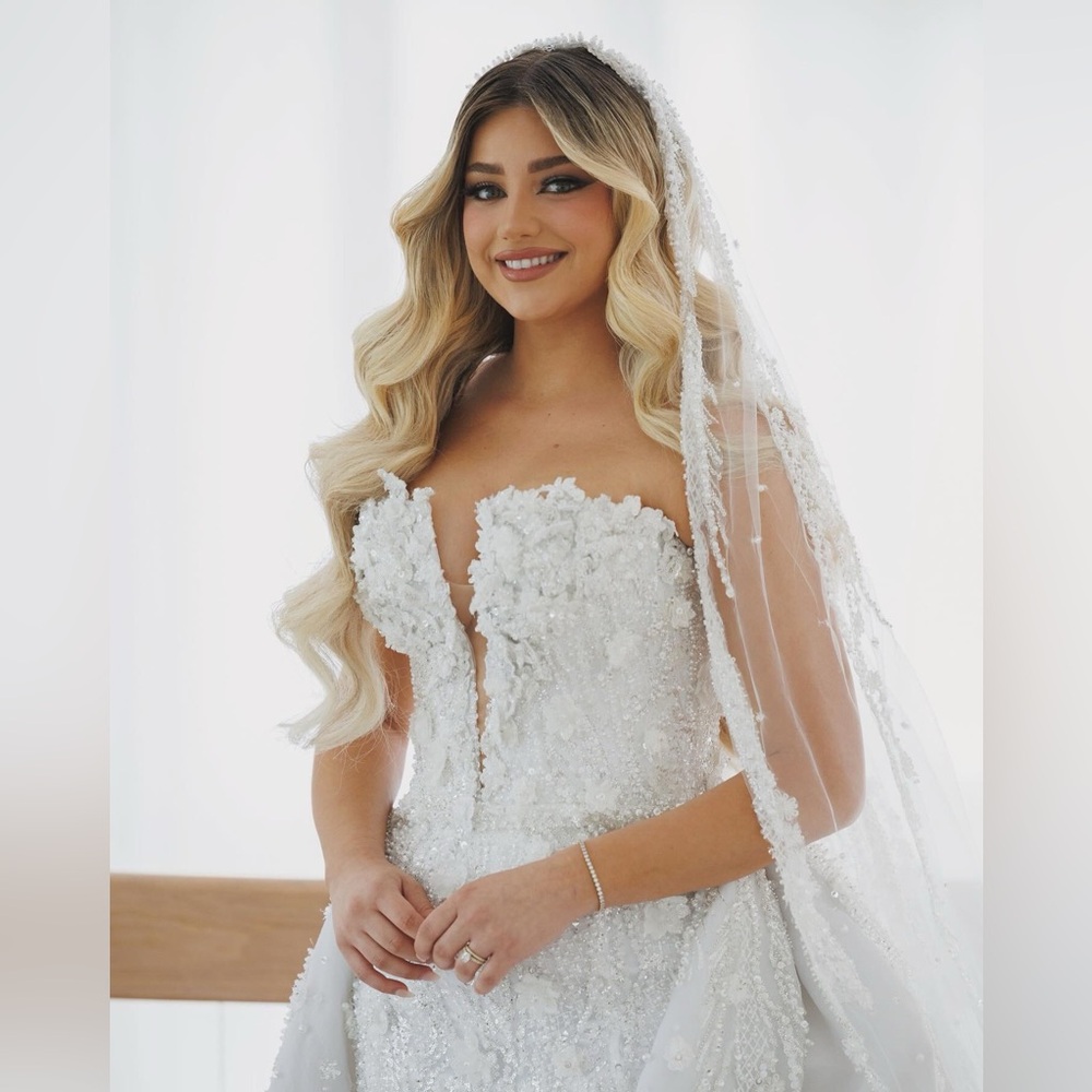 Wedding dress by Albina Dyla.
